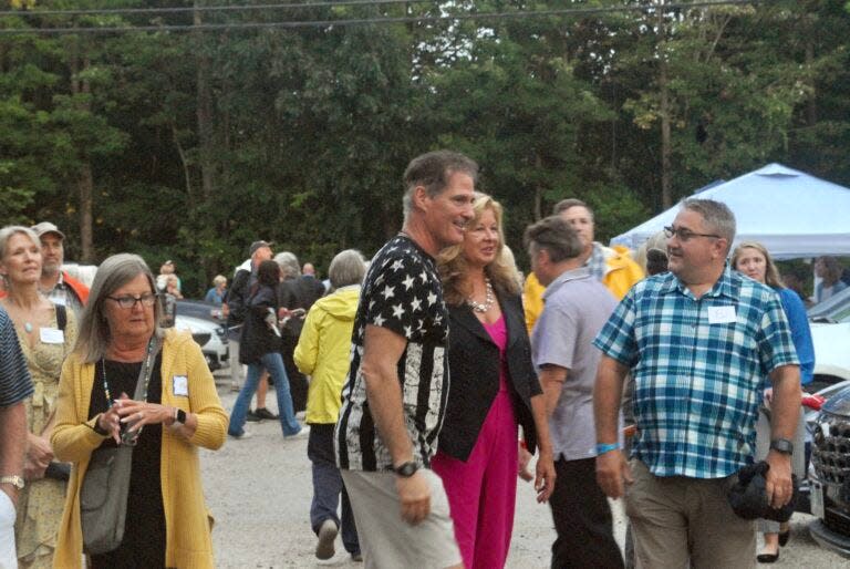 Former Massachusetts Sen. Scott Brown and wife Gail Huff Brown talk to attendees at their Sept. 13 “No BS Backyard BBQ” featuring Robert F. Kennedy Jr.