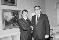 FILE - In this Oct. 1, 1975, file photo Abdelaziz Bouteflika, left, meets with U.S. Secretary of State Henry Kissinger at the U.S. State Department suite at the Waldorf Astoria Hotel Towers, in New York. Former Algerian President Bouteflika, who fought for independence from France in the 1950s and 1960s and was ousted amid pro-democracy protests in 2019 after 20 years in power, has died at age 84, state television announced Friday, Sept. 17, 2021. (AP Photo/Dave Pickoff, File)