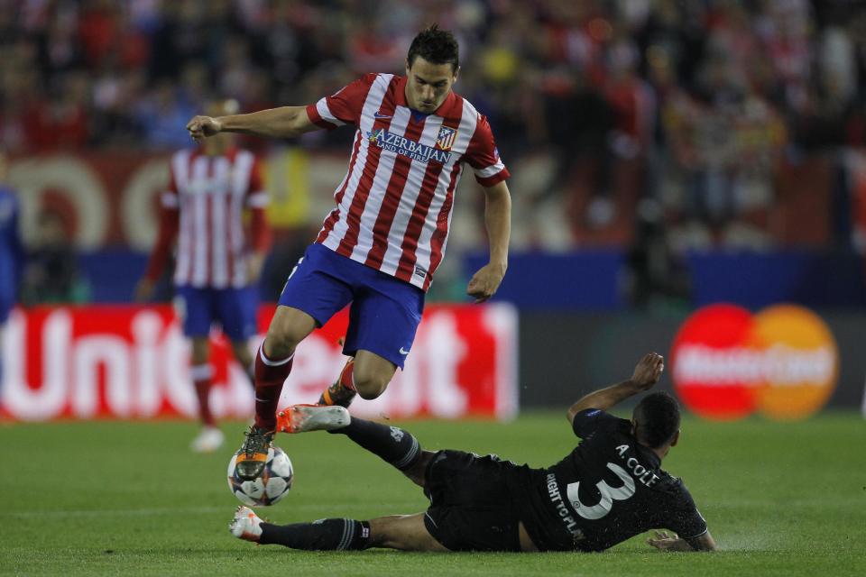 Atletico's Koke, left, in action with Chelsea's Ashley Cole during the Champions League semifinal first leg soccer match between Atletico Madrid and Chelsea at the Vicente Calderon stadium in Madrid, Spain, Tuesday April 22, 2014. (AP Photo/Gabriel Pecot)