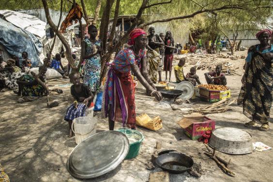 Women in Pibor’s market try to earn a living by selling items such as water and bush fruit (Bel Trew)