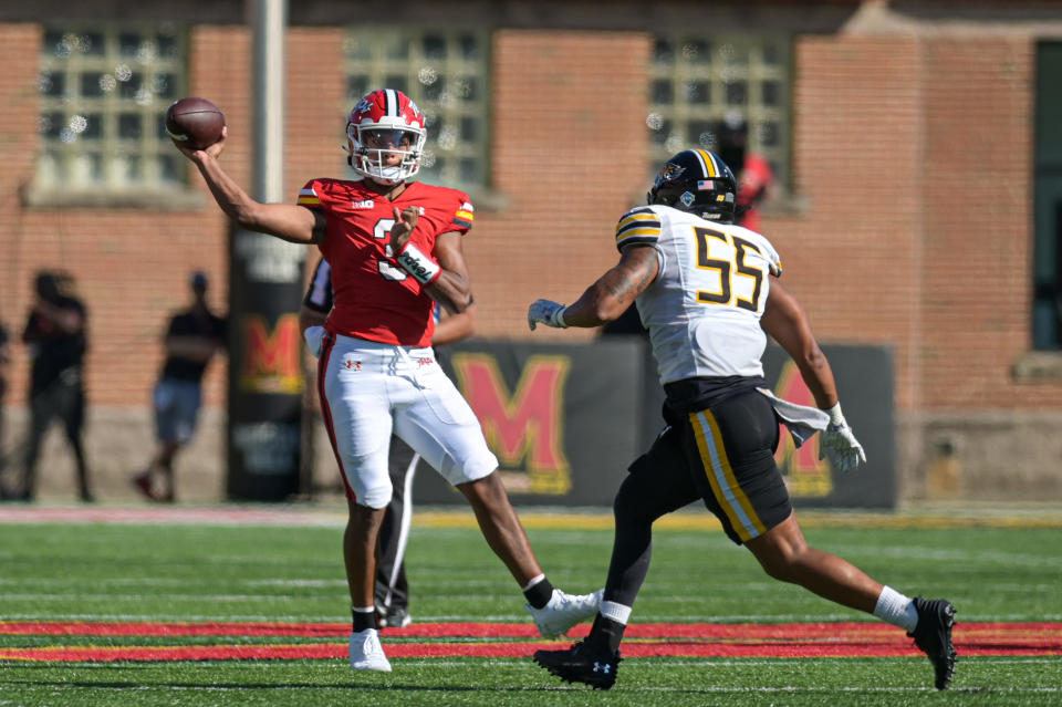 Sep 2, 2023; College Park, Maryland, USA; Maryland Terrapins quarterback Taulia Tagovailoa (3) throws on the run as Towson Tigers linebacker Mason Woods (55) applies pressure during the first half at SECU Stadium. Mandatory Credit: Tommy Gilligan-USA TODAY Sports