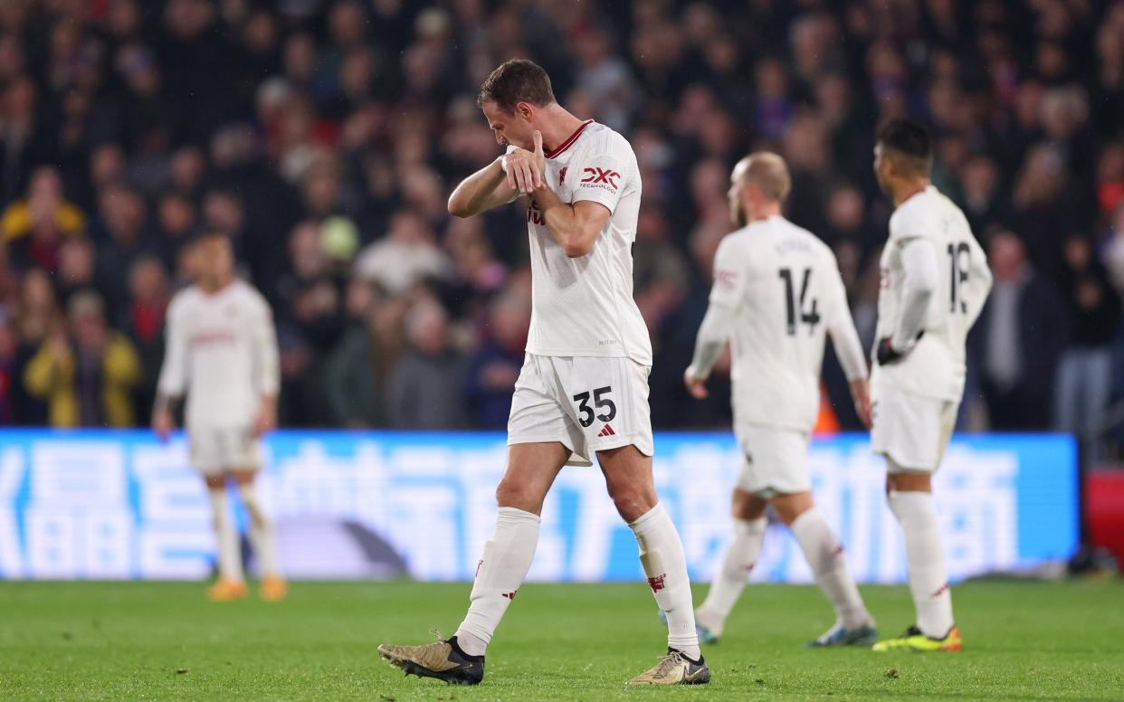 Jonny Evans of Manchester United looks dejected after Jean-Philippe Mateta