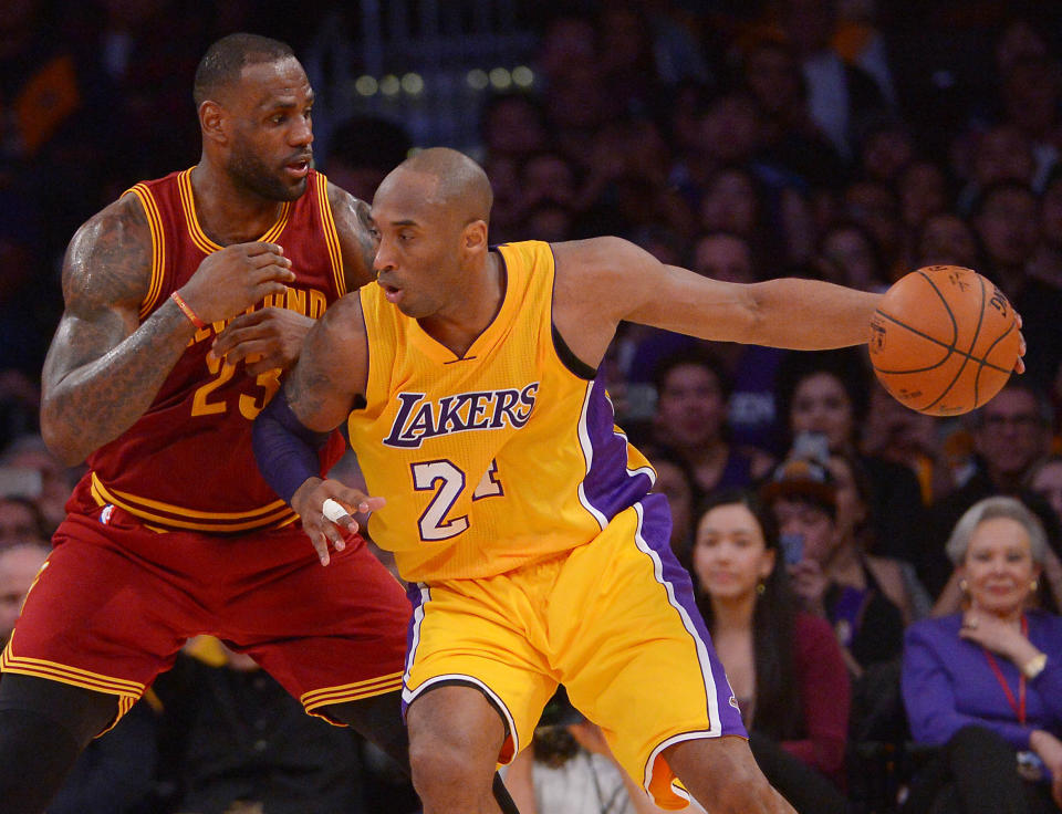 Mar 10, 2016; Los Angeles, CA, USA;  Cleveland Cavaliers forward LeBron James (23) guards Los Angeles Lakers forward Kobe Bryant (24) on the court in the first half of the game at Staples Center. Mandatory Credit: Jayne Kamin-Oncea-USA TODAY Sports