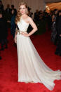  <p class="MsoNoSpacing">Amy Adams looked angelic in a couture one-shouldered cream gown from Giambattista Valli, which was accented with a gold bow belt, Brian Atwood shoes, Judith Leiber bag, and Fred Leighton jewels.</p>