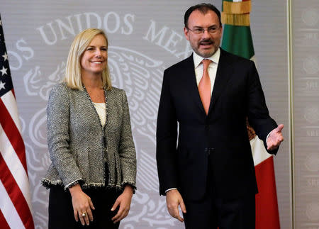 U.S. Homeland Security Secretary Kirstjen Nielsen poses with Mexico's Foreign Minister Luis Videgaray after delivering a joint message in Mexico City, Mexico March 26, 2018. REUTERS/Henry Romero