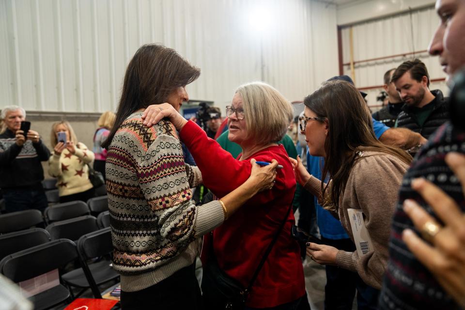 Supporters talk with GOP Presidential candidate Nikki Haley during a campaign stop in Waukee Sunday, Dec. 10, 2023, at Manning Ag Service.