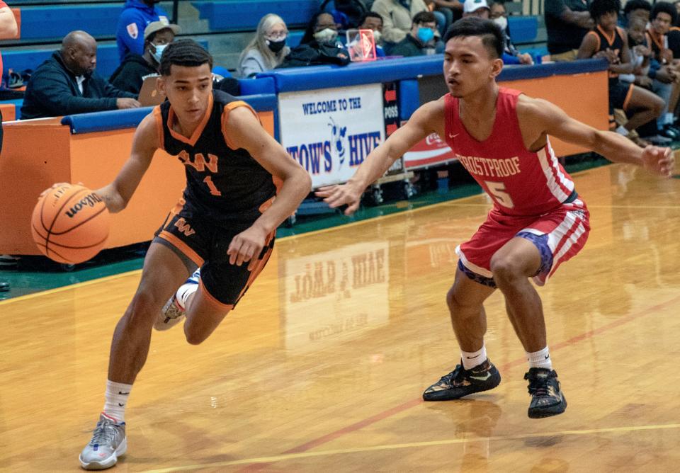 Lake Wales' Sevastian Rosado drives to the basket as Frostproof's Ryle Tenido defends on Saturday at the Mosaic 2022 Stinger Shootout at Bartow High School.