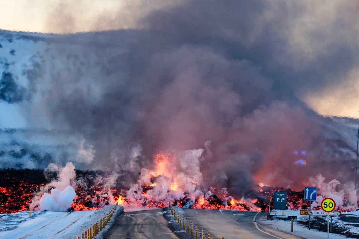 Molten lava blocking the road after another volcanic eruption (AFP via Getty Images)