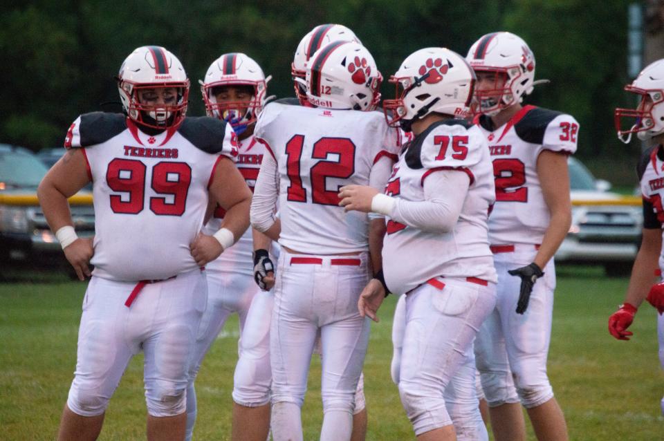 Litchfield quarterback Tyler Bills (12) led his offense to a 48-6 win over North Adams-Jerome