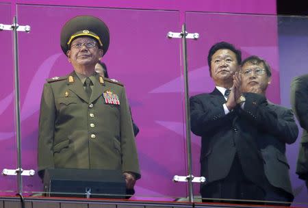 North Korea's Hwang Pyong So (L), a senior aide to North Korean leader Kim Jong Un, attends the closing ceremony of the 17th Asian Games at the Incheon Asiad Main Stadium, in this October 4, 2014 file photo. REUTERS/Jason Reed