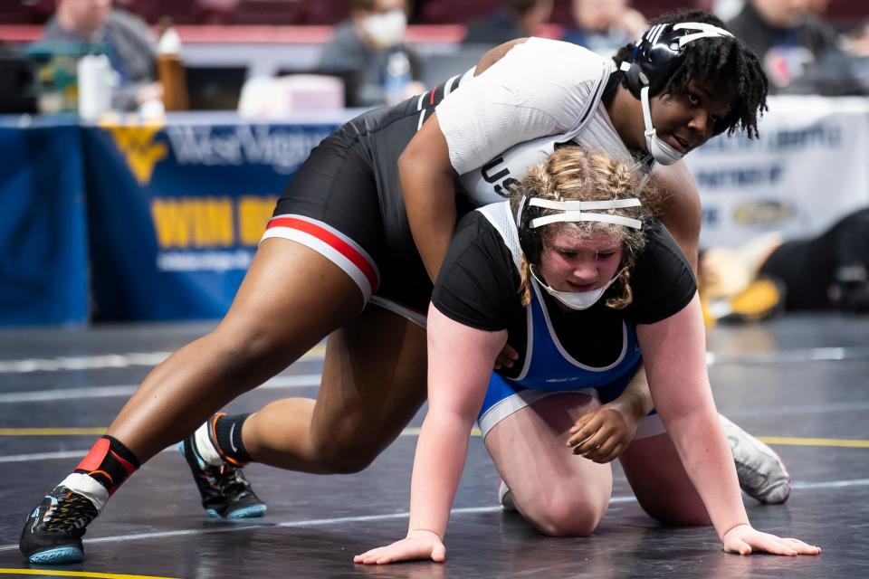 South Western's Kayla Henderson (top) wrestles to 3-2 decision over Bedford's Mylah Steinbuch in a 235-pound quarterfinal round bout at the PIAA Class Girls' Wrestling Championships at the Giant Center on March 8, 2024, in Hershey.