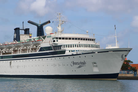 A 440-foot ship owned and operated by the Church of Scientology, SMV Freewinds, is docked under quarantine from a measles outbreak in port near Castries, St. Lucia, May 1, 2019. Picture taken May 1, 2019. REUTERS/Micah George