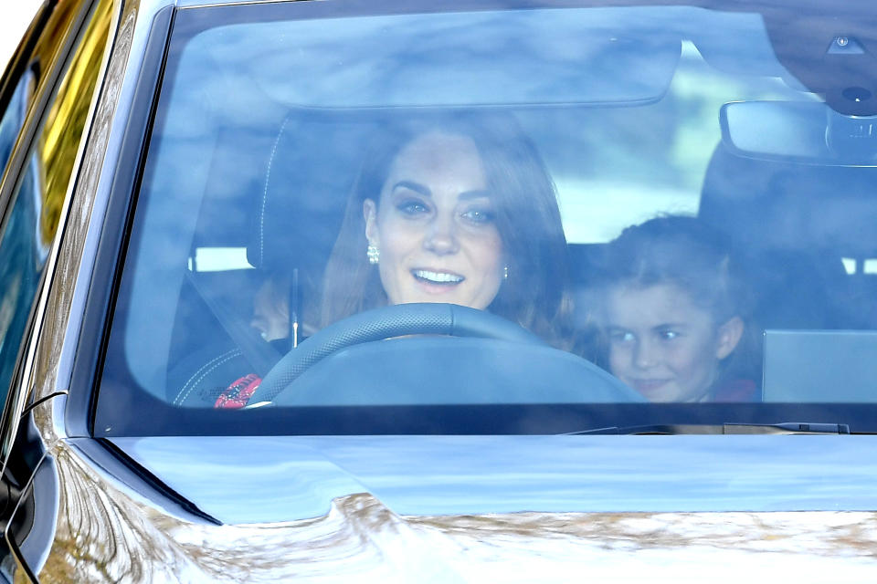 The Duchess  of Cambridge and Princess Charlotte arriving at the Queen's Christmas Lunch, Buckingham Palace, London. 