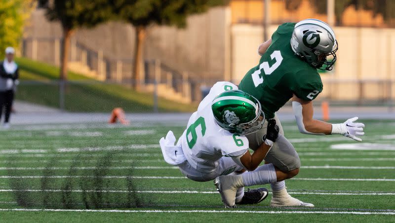 Provo’s Drew Deucher tackles Olympus’s Ty Seagle in the football game at Olympus High School in Holladay on Friday, Aug. 18, 2023.