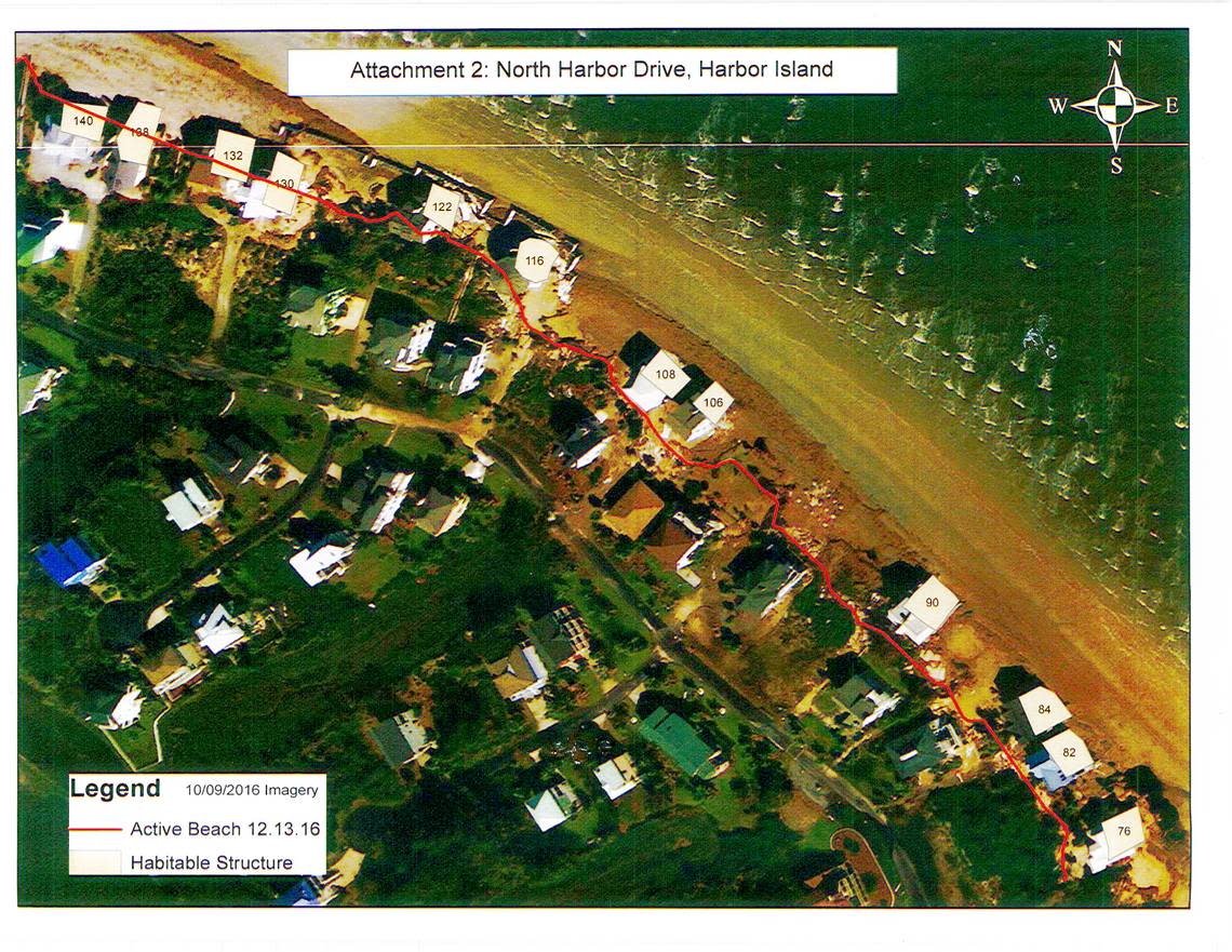 seven homes on North Harbor Drive on Harbor Island that the homeowners association is actively asking the state to to remove the structures located on the public waters of the state. The homes, unsafe to occupy, now sit seaward of the mean high tide mark caused by erosion, high tides, and past hurricanes and tropical storms. This map was produced prior to 116 North Harbor Drive which has since been demolished. Pictured are three of the