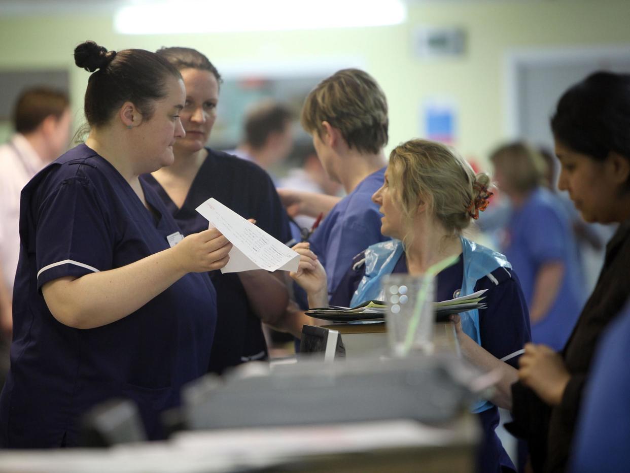 Nurses work during a busy shift in A&E at Selly Oak Hospital, Birmingham, last year: Getty