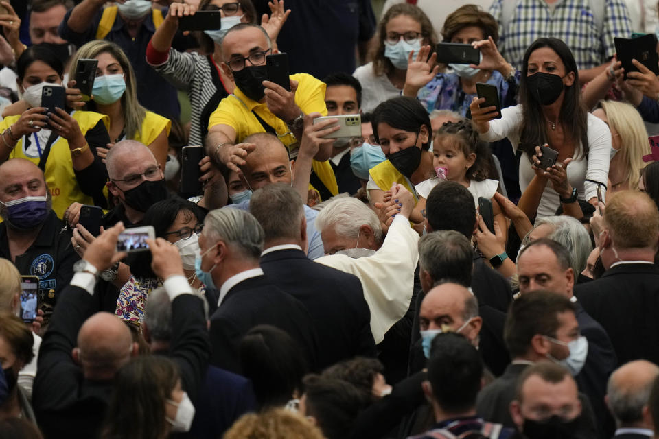 Pope Francis leaves after his weekly general audience in the Paul VI Hall at the Vatican, Wednesday, Sept. 29, 2021. (AP Photo/Alessandra Tarantino)