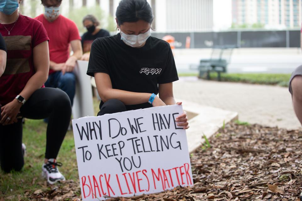 Those who attended Tallahassee's Black Lives Matter to Public Defenders protest knelt for eight minutes and 46 seconds, the same amount of time Minneapolis Police Officer Derek Chauvin knelt on the neck of George Floyd before his death, during Tallahassee's Black Lives Matter to Public Defenders protest at the Leon County Courthouse Monday, June 8, 2020. 