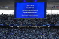 The display announces delay of the Champions League final soccer match between Liverpool and Real Madrid at the Stade de France in Saint Denis near Paris, Saturday, May 28, 2022. (AP Photo/Petr David Josek)