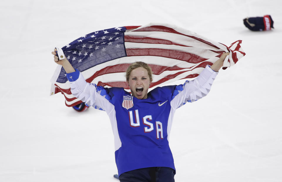 FILE - Jocelyne Lamoureux-Davidson (17), of the United States, celebrates after winning against Canada in the women's gold medal hockey game at the 2018 Winter Olympics in Gangneung, South Korea, Feb. 22, 2018. Longtime NHL goaltender Ryan Miller and Olympic gold medal-winning women’s hockey stars Jocelyne Lamoureux-Davidson and Monique Lamoureux-Morando headline the 2022 class of the U.S. Hockey Hall of Fame unveiled Thursday, Sept. 8, 2022. (AP Photo/Matt Slocum, File)