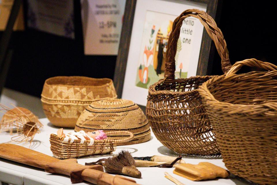 A group of of traditional baskets and tools from Stephanie Craig's personal collection are displayed during a presentation at the Museum of Natural and Cultural History in Eugene.