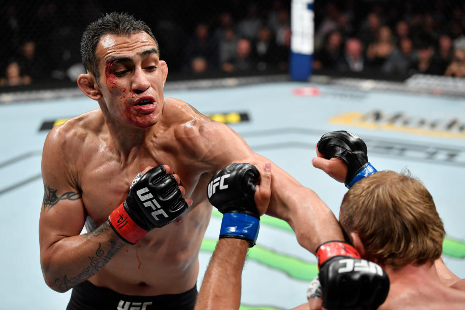 CHICAGO, IL - JUNE 08:  (L-R) Tony Ferguson punches Donald Cerrone in their lightweight bout during the UFC 238 event at the United Center on June 8, 2019 in Chicago, Illinois. (Photo by Jeff Bottari/Zuffa LLC/Zuffa LLC via Getty Images)