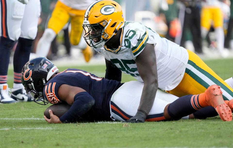 Green Bay Packers defensive tackle Devonte Wyatt (95) sacks Chicago Bears quarterback Justin Fields (1) during second half of their game on Sunday, Sept. 10, 2023 at Soldier Field in Chicago.