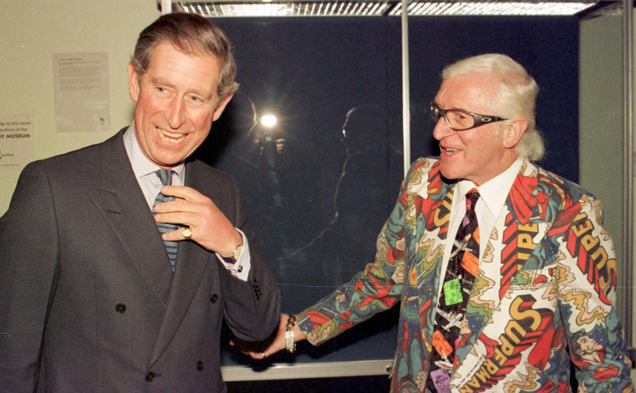 The Prince of Wales, who is patron of the British Forces Foundation, shares a joke with TV and radio personality Sir Jimmy Savile, during a reception at the Army Staff College, Sandhurst.   (Photo by Tim Ockenden - PA Images/PA Images via Getty Images)