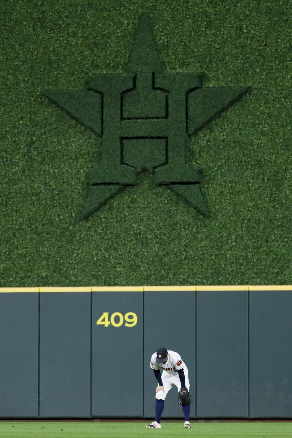 Houston Astros center fielder George Springer reacts after a home run by New York Yankees' Gio Urshela during the ninth inning in Game 1 of baseball's American League Championship Series Saturday, Oct. 12, 2019, in Houston. (AP Photo/Matt Slocum)