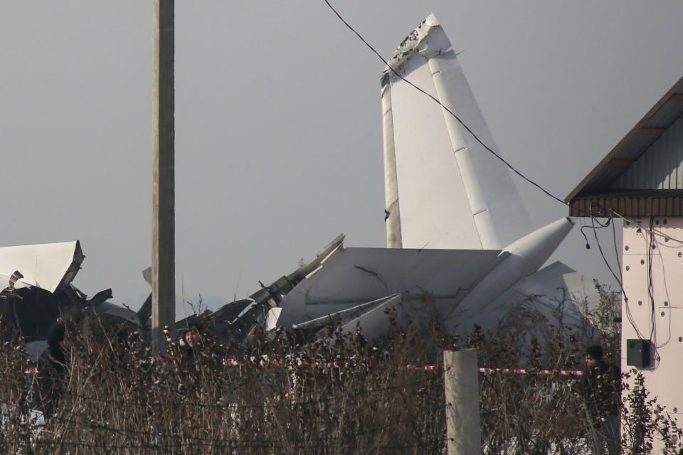 A view of the site of a passenger plane crash outside Almaty. - At least 15 people died on December 27, 2019 and dozens were reported injured when a passenger plane carrying 100 people crashed into a house shortly after takeoff from Kazakhstan's largest city. (Photo by Ruslan PRYANIKOV / AFP) (Photo by RUSLAN PRYANIKOV/AFP via Getty Images)