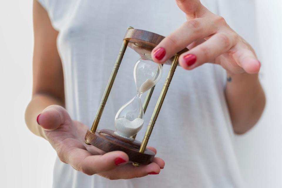 sand moving through an hourglass