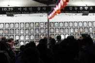 Mourners gather to pay their respects to victims during a rally marking the first anniversary of the crowd surge that killed about 160 people in a Seoul alleyway, at a memorial altar set up at the Seoul Plaza, South Korea, Sunday, Oct. 29, 2023. (AP Photo/Ahn Young-joon)