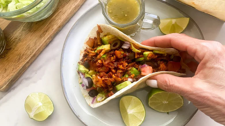 Shredded tofu taco on plate