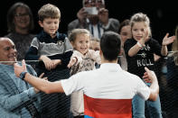 Serbia's Novak Djokovic goes his son Stefan after defeating Russia's Daniil Medvedev during the final match of the Paris Masters tennis tournament at the Accor Arena in Paris, Sunday, Nov.7, 2021. Djokovic won 4-6, 6-3, 6-3. (AP Photo/Thibault Camus)
