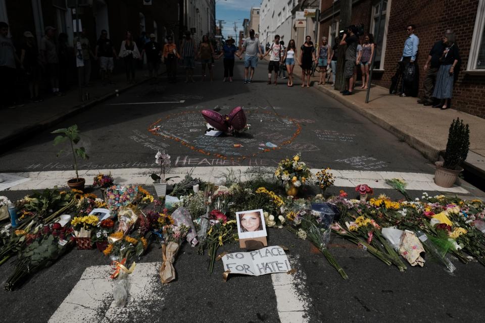 Flowers and a photo of car ramming victim Heather Heyer lie at a makeshift memoriall in Charlottesville, Virginia,  August 13, 2017.