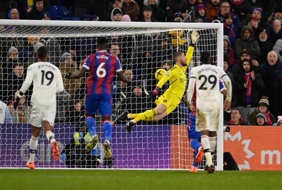 Crystal Palace’s Michael Olise scores from a free-kick past Manchester United’s David de Gea.