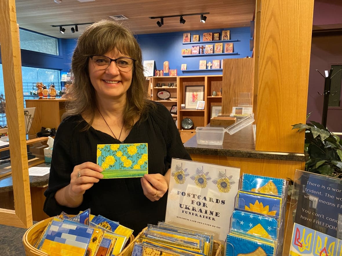 Monika Kinner is a textile artist who created fabric postcards as a fundraiser to help people in Ukraine. (Travis Reddaway/CBC - image credit)