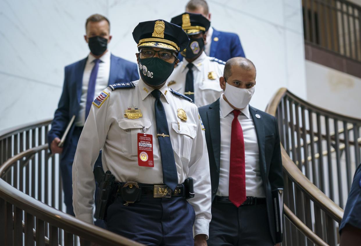 Washington Metropolitan Police Chief Robert Contee arrives to join U.S. Capitol Police Chief Tom Manger at a news conference to discuss preparations for a weekend rally planned by allies of Donald Trump who support the so-called "political prisoners" of the Jan. 6 attack on the Capitol, Friday, Sept. 17, 2021, in Washington, D.C.