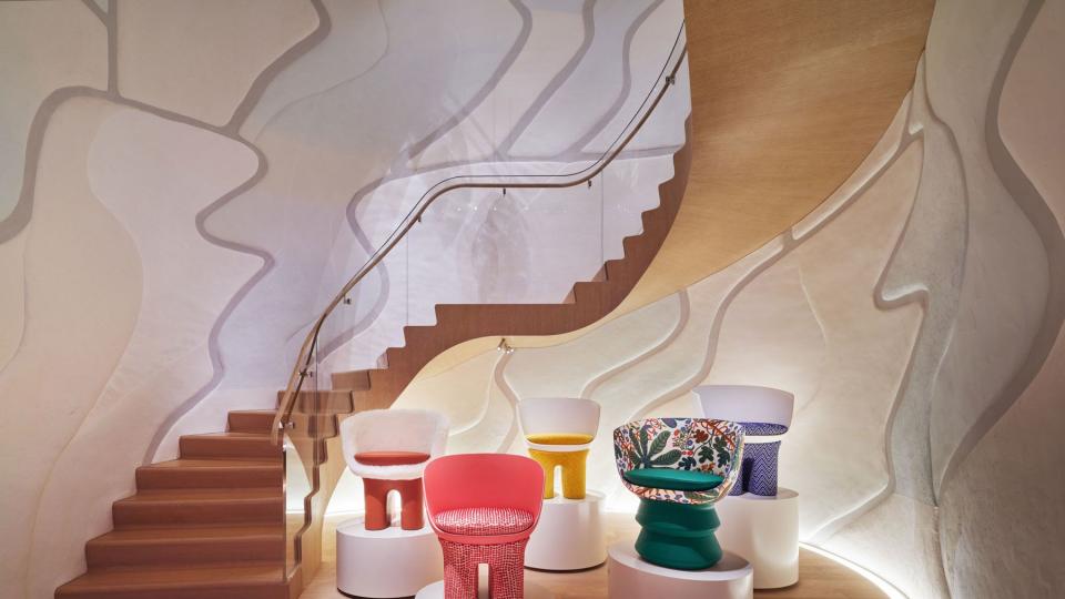 Staircase with chair exhibit at Louis Vuitton