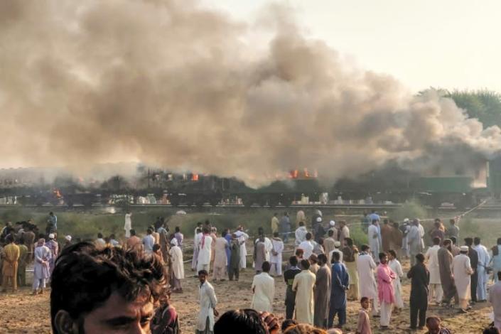 Some of the passengers -- many of whom were religious pilgrims travelling to a congregation in the eastern city of Lahore -- had been cooking breakfast when two of their gas cylinders exploded, officials said At least 65 people were killed and dozens wounded after a passenger train erupted in flames in central Pakistan on October 31, a provincial minister said. (AFP Photo/Handout)
