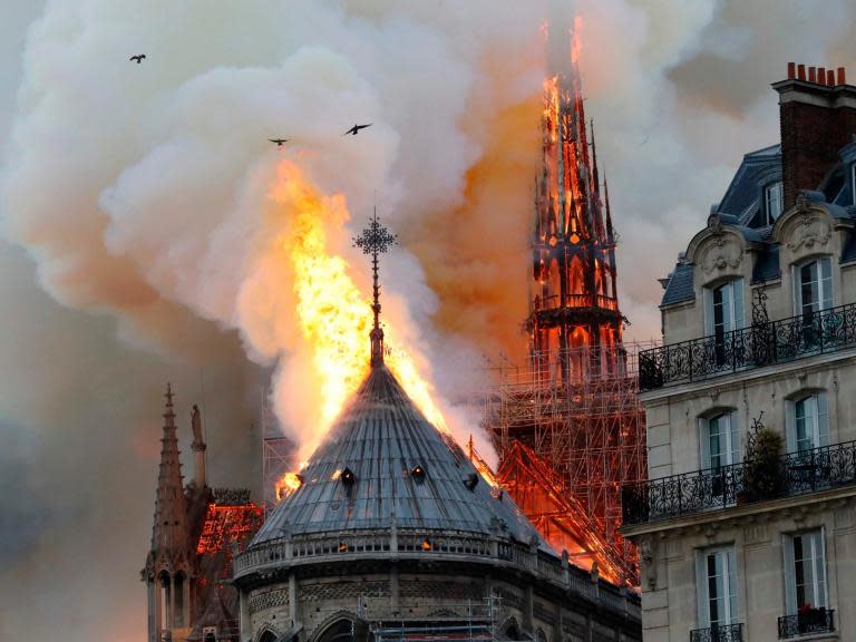 Notre Dame cathedral fire: Historic landmark's roof and spire collapse in centre of Paris