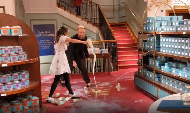 Grab from video issued by Animal Rebellion of supporters of Animal Rebellion pouring out milk in Fortnum & Mason in London. (Photo: Animal Rebellion via PA Media)