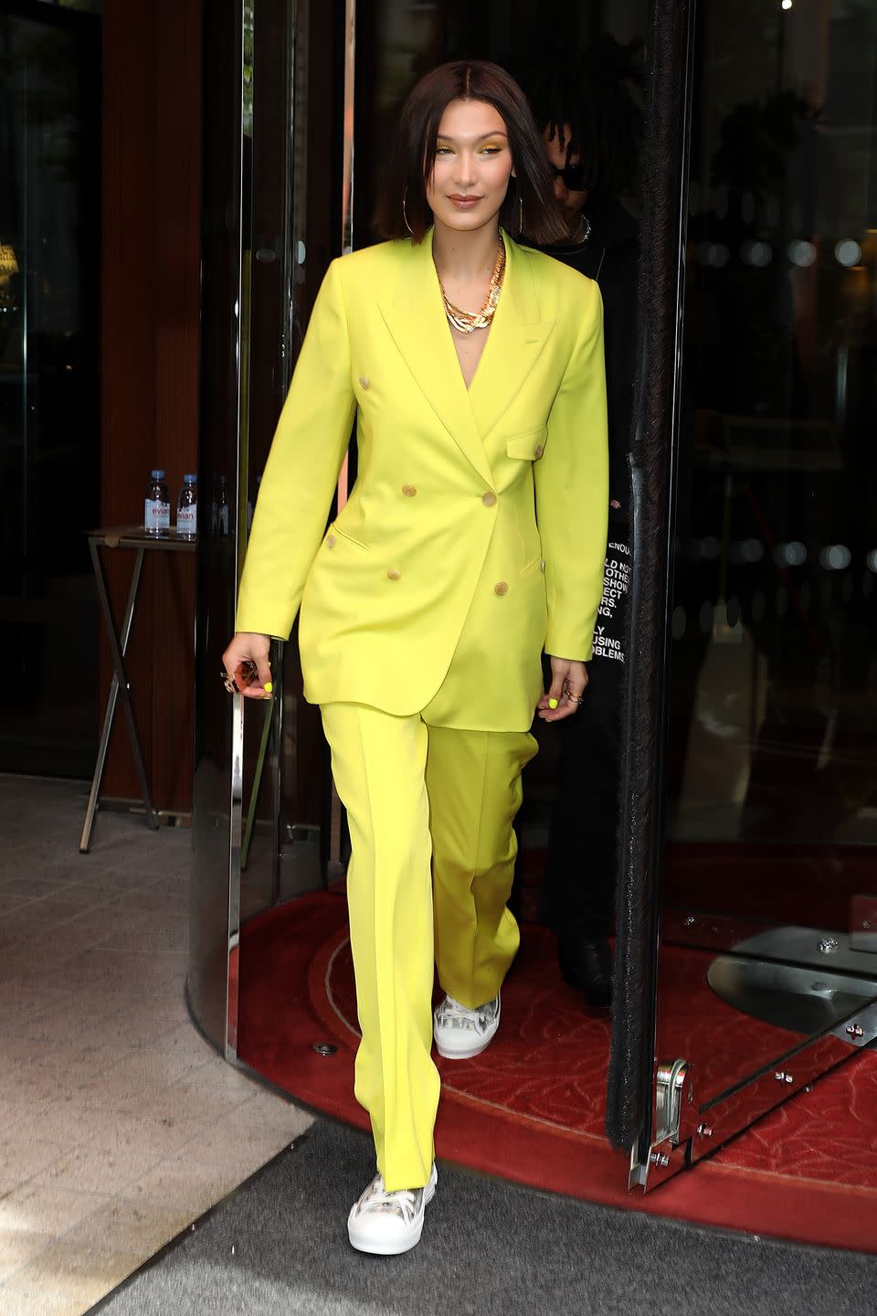 <p>Wearing a bright yellow suit, heading to the Dior Homme show in Paris. <em><a href="http://www.dailymail.co.uk/tvshowbiz/article-5879961/Bella-Hadid-reveals-slender-waistline-tiny-crop-steps-Paris.html" rel="nofollow noopener" target="_blank" data-ylk="slk:The Daily Mail;elm:context_link;itc:0;sec:content-canvas" class="link ">The Daily Mail</a></em> reports that Hadid had a wardrobe malfunction later in the day in the form of a nip slip. </p>