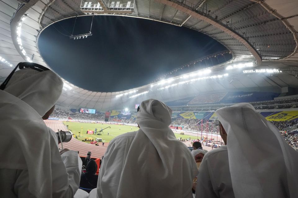 Fans watch from the stands at the World Athletics Championships in Doha, Qatar, Thursday, Oct. 3, 2019. (AP Photo/Morry Gash)