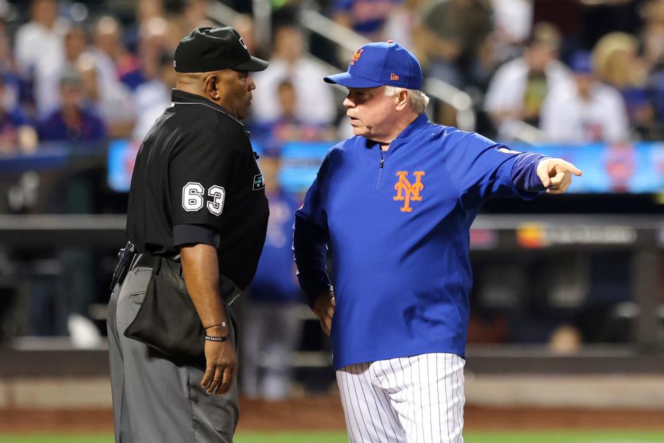 New York Mets manager Buck Showalter talks with umpire Laz Diaz (63) during the fourth inning of the team's baseball game against the Chicago Cubs on Tuesday, Sept. 13, 2022, in New York.