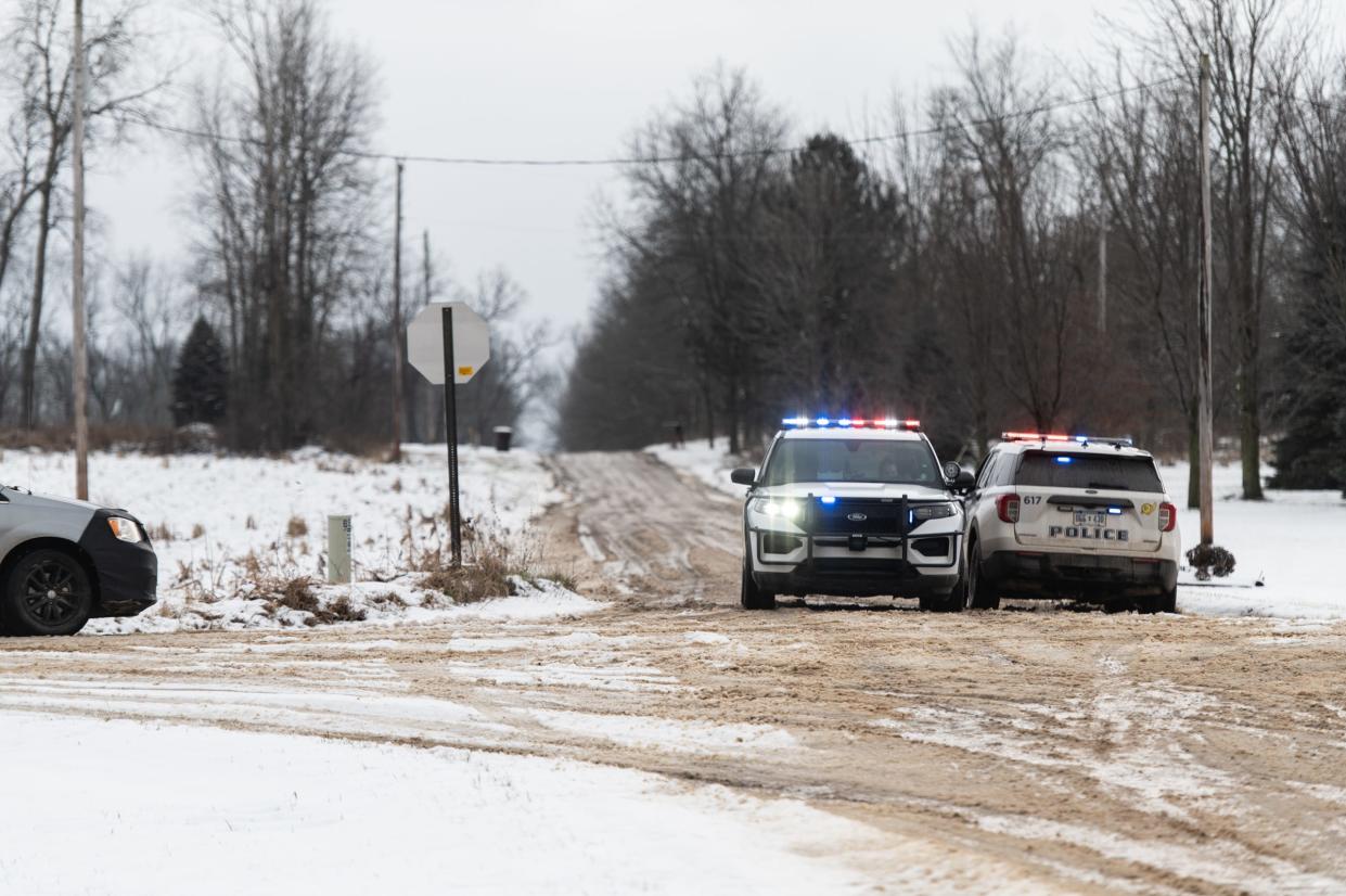 Grand Ledge Police block access to Gates Road at Saginaw Highway in rural Eaton County on Thursday afternoon, Jan. 11, 2024. The Eaton County Sheriff's Office later said deputies shot and killed a man sought by Charlotte police.