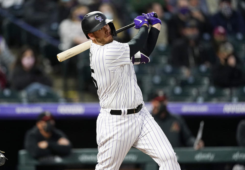 Colorado Rockies' C.J. Cron watches his RBI double off Arizona Diamondbacks starting pitcher Madison Bumgarner during the third inning of a baseball game Wednesday, April 7, 2021, in Denver. (AP Photo/David Zalubowski)