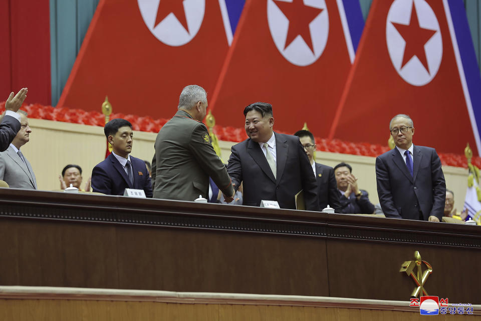 In this photo provided by the North Korean government, North Korean leader Kim Jong Un, center, shakes hands with Russian Defense Minister Sergei Shoigu, left, as they and China's Vice Chairman of the standing committee of the country’s National People’s Congress Li Hongzhong, right, attend a meeting to mark the 70th anniversary of the armistice that halted fighting in the 1950-53 Korean War, in Pyongyang, North Korea Thursday, July 27, 2023. Independent journalists were not given access to cover the event depicted in this image distributed by the North Korean government. The content of this image is as provided and cannot be independently verified. Korean language watermark on image as provided by source reads: "KCNA" which is the abbreviation for Korean Central News Agency. (Korean Central News Agency/Korea News Service via AP)