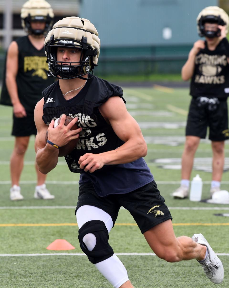 Corning's James Freeman carries the ball as the Hawks football team practices Aug. 18, 2024 at Corning Memorial Stadium.