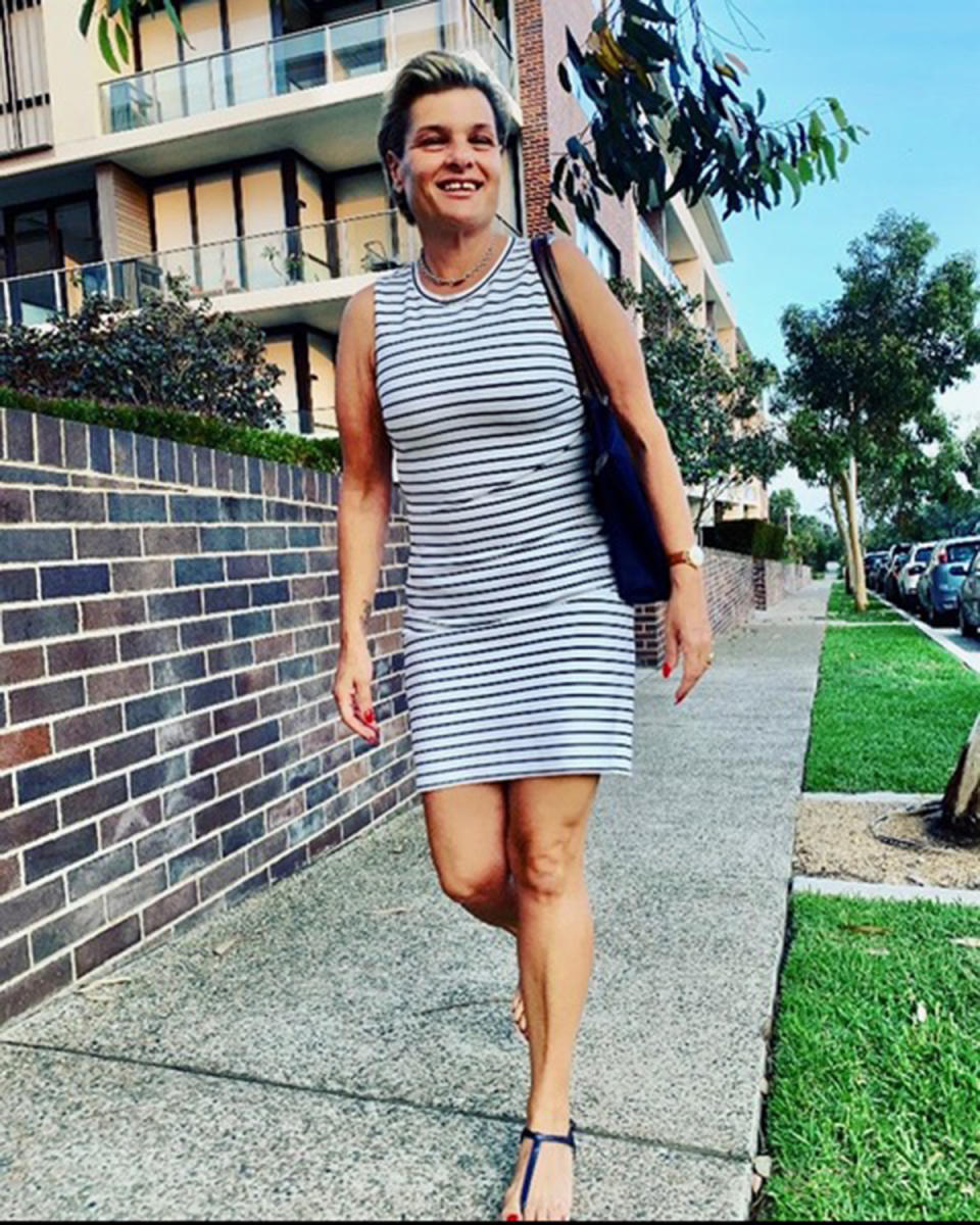 A photo of Sydney woman Maria wearing a black and white striped dress